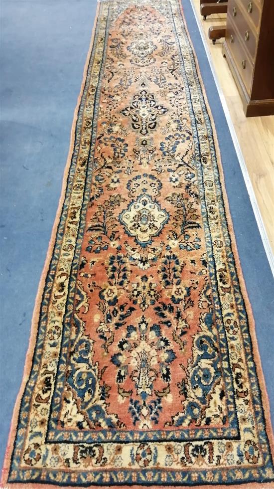 A North West Persian style red ground runner Approx. 430 x 82cm
